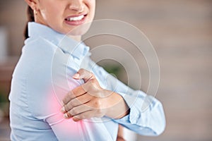 Business woman, shoulder pain and injury from accident, inflammation or sore joint at office. Closeup of female person