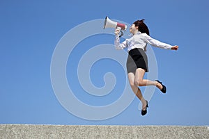 Business woman shouting megaphone