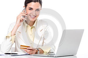 Business woman showing credit card while working