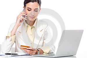 Business woman showing credit card while working