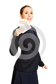 Business woman showing euro currency money.