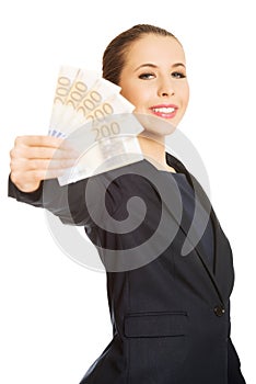 Business woman showing euro currency money.