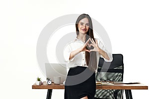 business woman showing heart shape with gesture