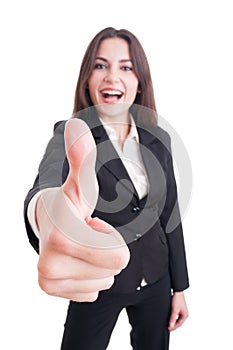 Business woman showing like gesture with selective focus on hand