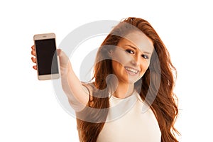 Business woman showing a message on a screen of a smart phone is