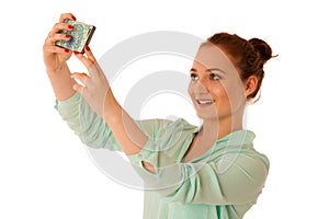 Business woman showing a message on a screen of a smart phone is