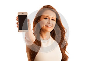 Business woman showing a message on a screen of a smart phone is
