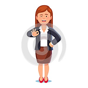 Business woman showing okay sign and winking