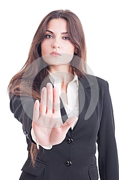 Business woman showing palm as stop, stay, decline or refuse