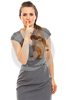 Business woman showing shhh... gesture photo