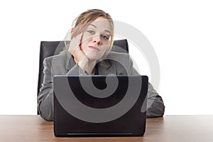 Young business woman sitting a her desk