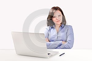 Business woman is sitting in front of a laptop photo