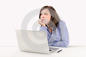 Business woman is sitting in front of a laptop photo