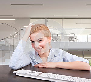 Business woman sitting at her desk