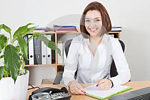 Business woman sitting in office with fingers hands touching her chin