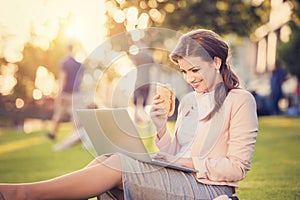 Business woman sitting in a park