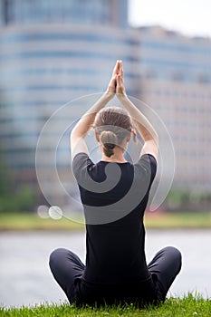 Business woman sitting in yoga pose