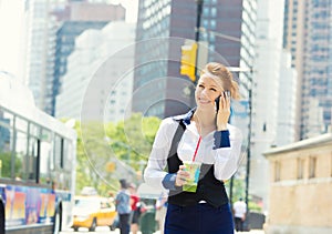 Business woman on smart phone in New York City, Manhattan