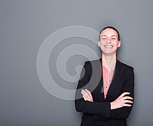 Business woman smiling with arms crossed