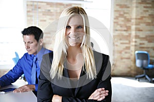 Business Woman Smiling with Business Man working in Urban Brick Modern Office photo