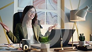 Business woman smiling video call rejoicing work success at office desk closeup.