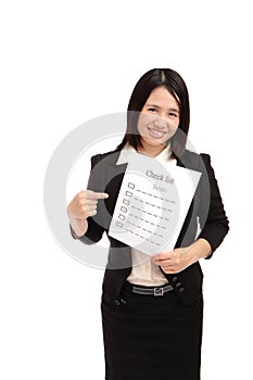 Business woman smilingly take check item paper photo