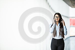 Business woman speak phone in modern office.