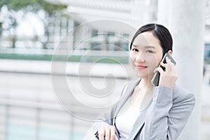 Business woman speak smart phone