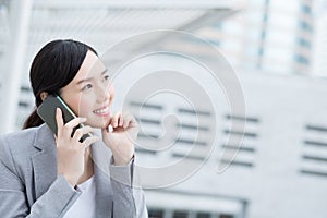 Business woman speak smart phone