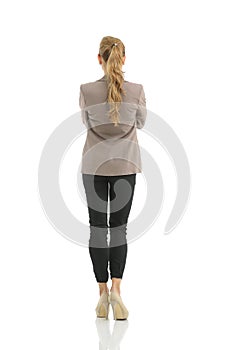 Business woman stand back side with white wall background