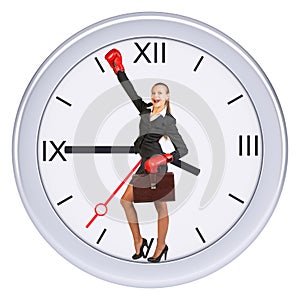 Business woman standing in center of clock