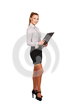 Business woman standing with a folder in hands