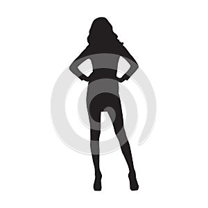 Business woman standing with hands on hips, isolated vector silhouette. Front view