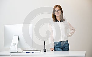 Business woman standing hear her workplace