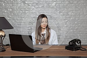 Business woman staring at the phone, waiting for an important ca