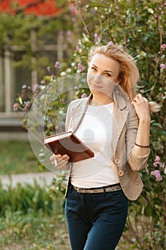 Business woman on the street with a diary in her hands. Content Photography