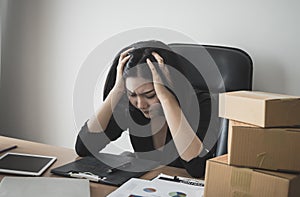 Business woman stressed out with work on office desk