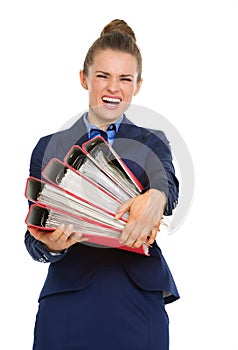 Business woman struggling to carry big files