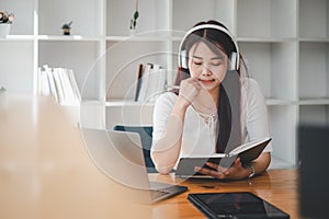 Business woman student teacher tutor wear wireless headset video conference calling on laptop computer talk