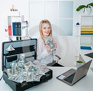 Business woman successful with US dollars money in hand feeling happy and smile, bankruptcy economic financial concept.