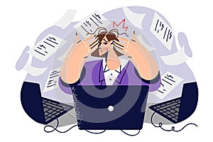 Business woman suffers from spam on internet and clutches head sitting in office among flying papers