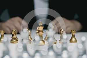 business woman in a suit plays chess. Close-up of a female hand on a pawn chess board game competition business concept, Selective
