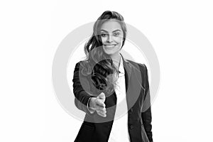 Business woman in suit smiling friendly offering handshake as greeting and welcoming. Successful business. Businesswoman