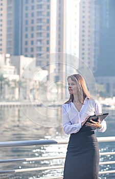 Business woman taking notes.