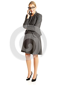 Business woman talking on her mobile phone