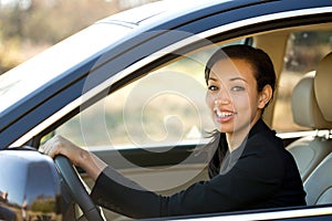 Business woman talking on her mobile phone. outside an office bussiness. photo