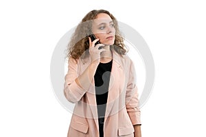 Business woman talking on the phone while she looks aside white background
