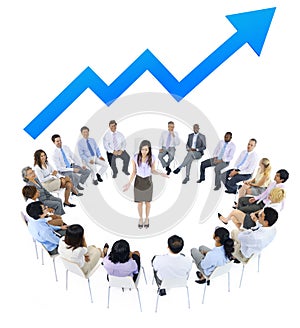 Business Woman Talking to Business People and Line Graph Above