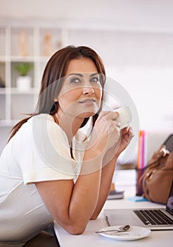 Business woman, thinking and coffee cup in office for break, brainstorming and planning at desk. Worker, editor or