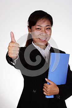 Business woman with thumbs up